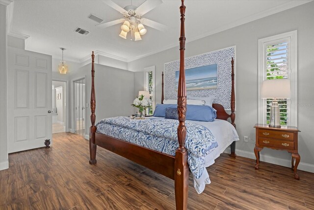 427 Autumn Chase Dr, Venice, FL 34292 - bedroom featuring wood finished floors, multiple windows, crown molding, baseboards, and a ceiling fan