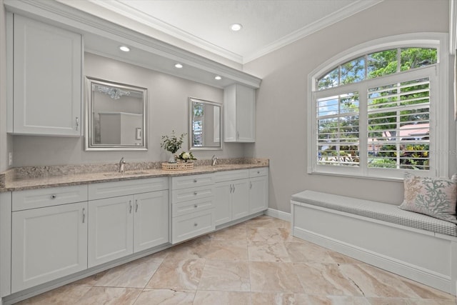 427 Autumn Chase Dr, Venice, FL 34292 - bathroom featuring ornamental molding, recessed lighting, marble look tiles, baseboards, and double vanity