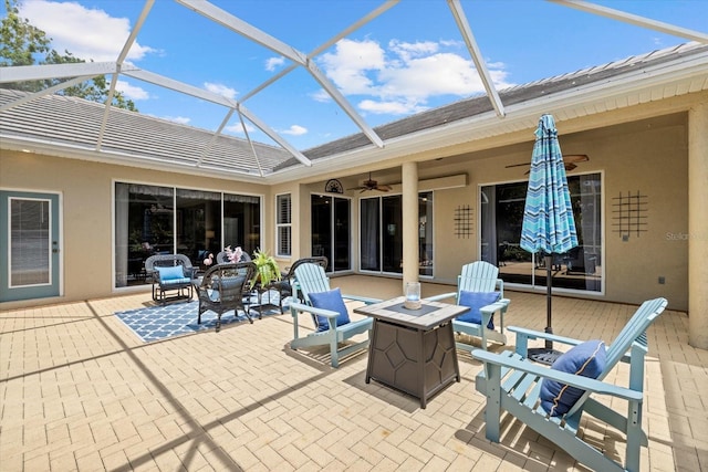 427 Autumn Chase Dr, Venice, FL 34292 - view of patio / terrace with a fire pit, a ceiling fan, and glass enclosure