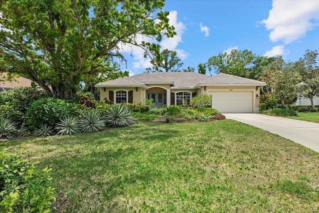 427 Autumn Chase Dr, Venice, FL 34292 - single story home featuring an attached garage, stucco siding, driveway, and a front lawn