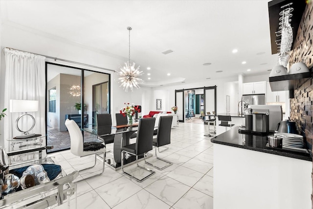329 Myrtle Ave, Nokomis, FL 34275 - dining area featuring a chandelier, recessed lighting, a barn door, and light marble finish floors