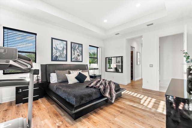 329 Myrtle Ave, Nokomis, FL 34275 - bedroom with a raised ceiling, light wood finished floors, baseboards, and recessed lighting