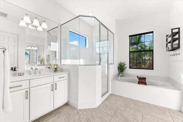 329 Myrtle Ave, Nokomis, FL 34275 - bathroom with a garden tub, vanity, a stall shower, and a chandelier