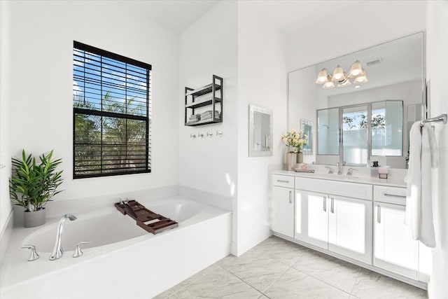 329 Myrtle Ave, Nokomis, FL 34275 - full bath featuring vanity, a bath, marble look tile flooring, and a chandelier