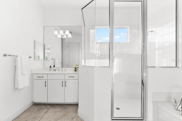 329 Myrtle Ave, Nokomis, FL 34275 - bathroom featuring vanity, a shower stall, a bath, and baseboards