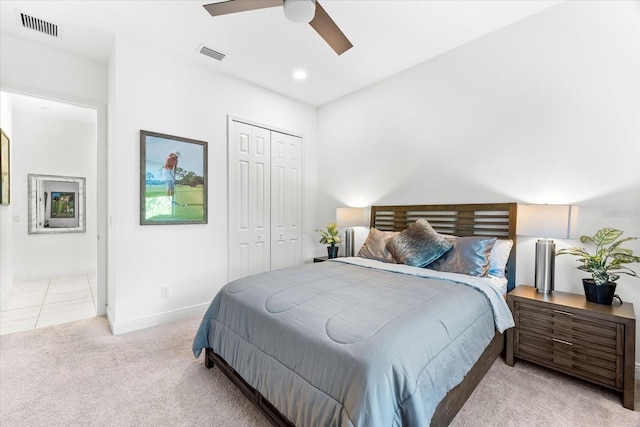 329 Myrtle Ave, Nokomis, FL 34275 - bedroom with light colored carpet, a closet, baseboards, ceiling fan, and ensuite bath