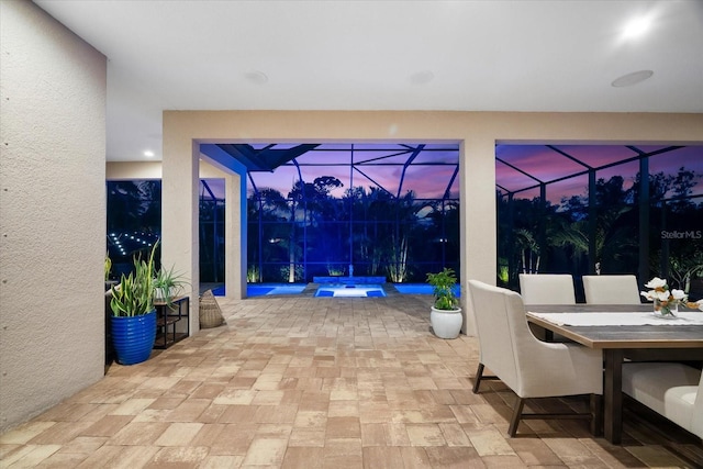 329 Myrtle Ave, Nokomis, FL 34275 - view of patio featuring glass enclosure, outdoor dining area, a jacuzzi, and an outdoor pool