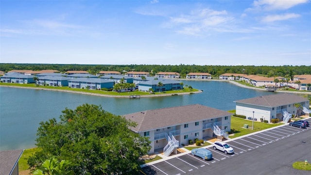 aerial perspective of suburban area with a large body of water