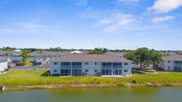 aerial perspective of suburban area with a large body of water