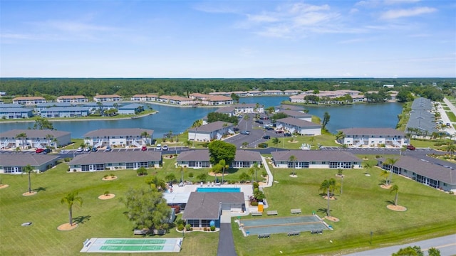 aerial view of residential area with a large body of water