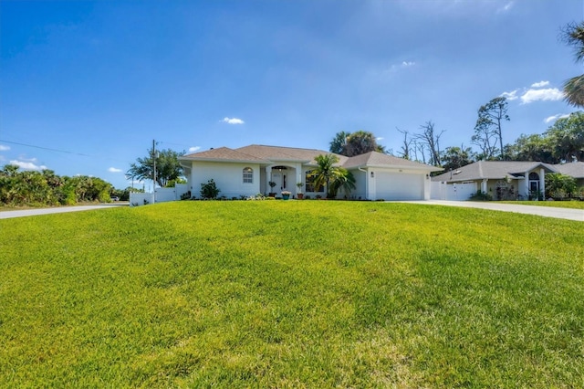 single story home featuring an attached garage, concrete driveway, and stucco siding