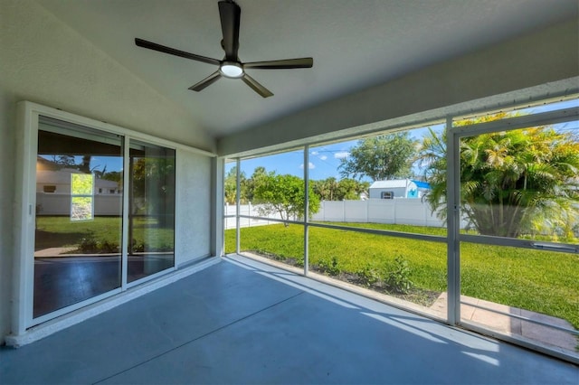 unfurnished sunroom with lofted ceiling and plenty of natural light