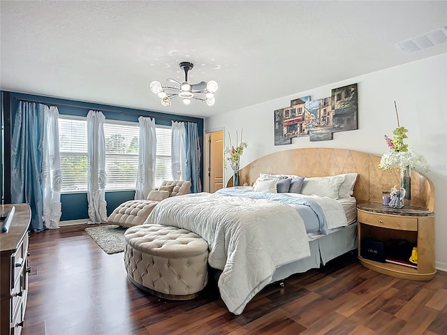 9019 39th Street Cir E, Parrish, FL 34219 - bedroom with a chandelier, dark wood finished floors, and baseboards