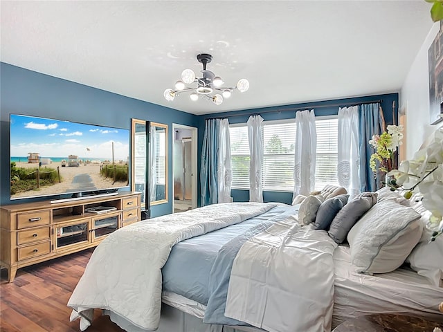 9019 39th Street Cir E, Parrish, FL 34219 - bedroom with a chandelier and dark wood finished floors