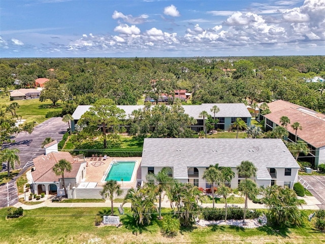 1730 Manasota Beach Rd Unit 215, Englewood, FL 34223 - view from above of property featuring a pool and a heavily wooded area