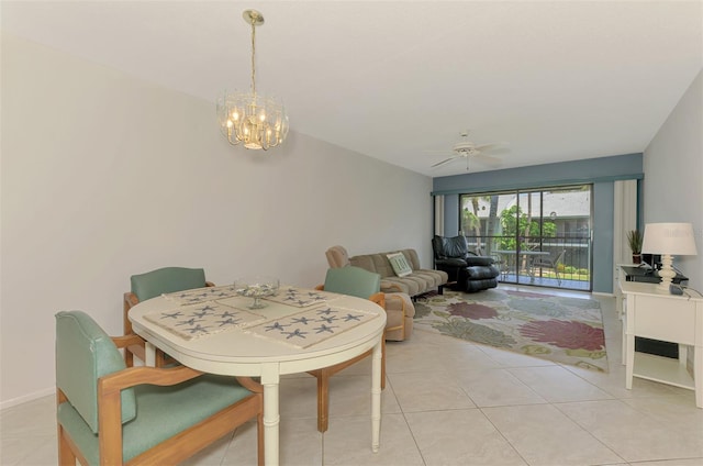 1730 Manasota Beach Rd Unit 215, Englewood, FL 34223 - dining area with a chandelier, ceiling fan, and light tile patterned floors
