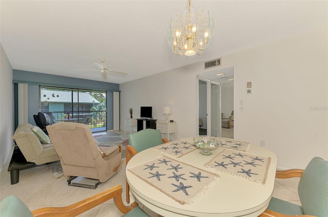 1730 Manasota Beach Rd Unit 215, Englewood, FL 34223 - dining room featuring a ceiling fan, light tile patterned floors, and a chandelier