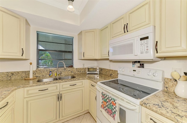1730 Manasota Beach Rd Unit 215, Englewood, FL 34223 - kitchen featuring white appliances, cream cabinets, and a sink