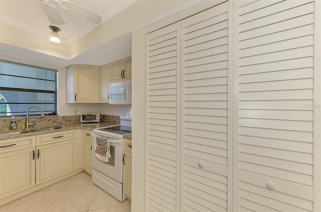 1730 Manasota Beach Rd Unit 215, Englewood, FL 34223 - kitchen featuring white appliances, cream cabinetry, a sink, light tile patterned floors, and light stone counters
