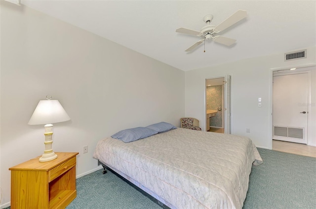 1730 Manasota Beach Rd Unit 215, Englewood, FL 34223 - carpeted bedroom with baseboards, connected bathroom, and ceiling fan