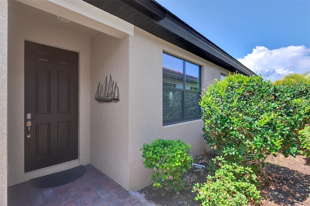 20636 Swallowtail Ct, Venice, FL 34293 - property entrance with stucco siding
