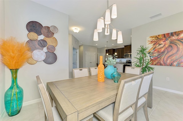20636 Swallowtail Ct, Venice, FL 34293 - dining space with light tile patterned floors and baseboards