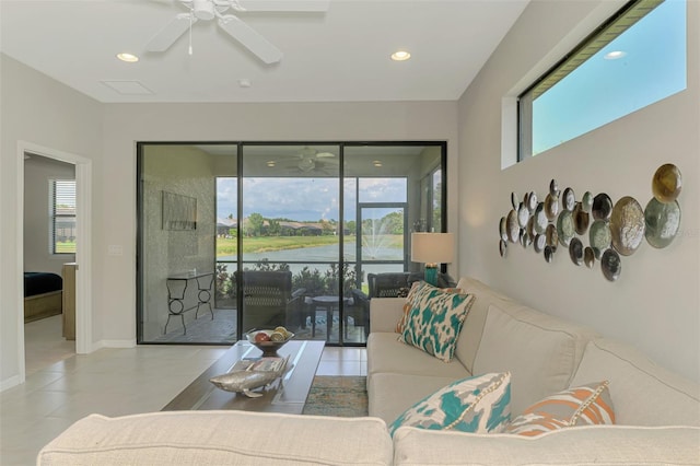 20636 Swallowtail Ct, Venice, FL 34293 - tiled living area with ceiling fan, recessed lighting, baseboards, and a water view