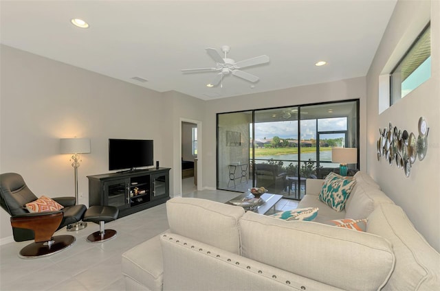 20636 Swallowtail Ct, Venice, FL 34293 - living area with tile patterned flooring, ceiling fan, recessed lighting, and baseboards