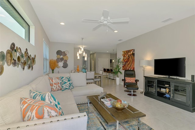 20636 Swallowtail Ct, Venice, FL 34293 - living room with a chandelier, a ceiling fan, light tile patterned floors, and recessed lighting