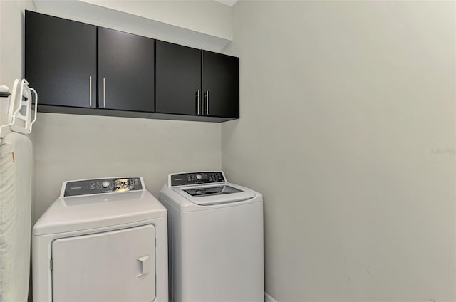 20636 Swallowtail Ct, Venice, FL 34293 - washroom with cabinet space and independent washer and dryer