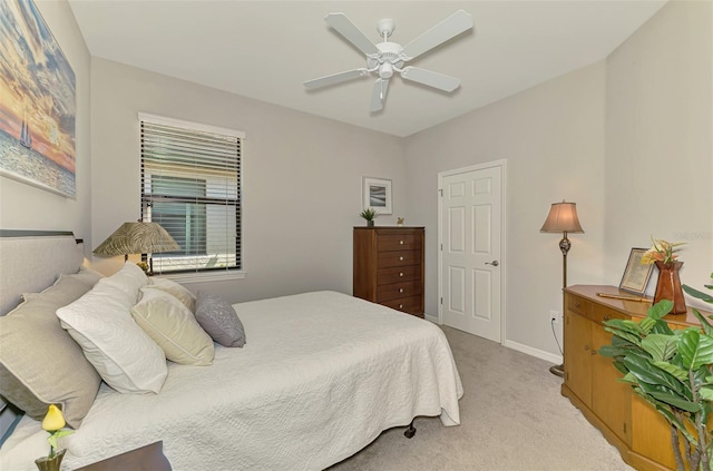 20636 Swallowtail Ct, Venice, FL 34293 - bedroom with light carpet, a ceiling fan, and baseboards