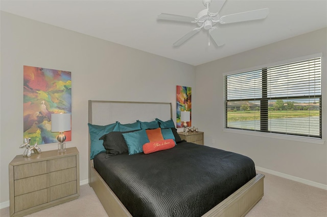 20636 Swallowtail Ct, Venice, FL 34293 - bedroom with light colored carpet, baseboards, and a ceiling fan