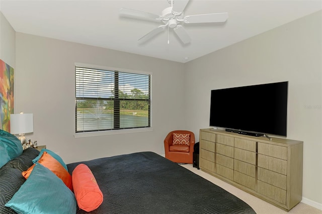 20636 Swallowtail Ct, Venice, FL 34293 - bedroom featuring light carpet, ceiling fan, and baseboards
