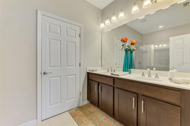 20636 Swallowtail Ct, Venice, FL 34293 - full bath featuring a shower stall, tile patterned floors, baseboards, and double vanity