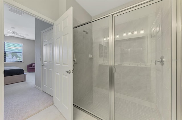 20636 Swallowtail Ct, Venice, FL 34293 - bathroom with ceiling fan, a shower stall, and ensuite bath