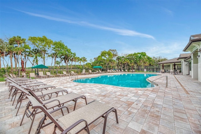 20636 Swallowtail Ct, Venice, FL 34293 - community pool featuring fence and a patio area