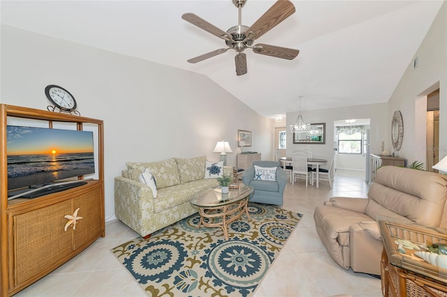 6796 Gasparilla Pines Blvd Unit 18, Englewood, FL 34224 - living room with lofted ceiling, light tile patterned floors, ceiling fan, baseboards, and a chandelier