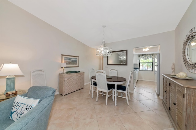 6796 Gasparilla Pines Blvd Unit 18, Englewood, FL 34224 - dining room with lofted ceiling, light tile patterned floors, and baseboards