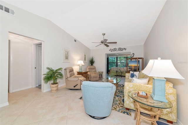 6796 Gasparilla Pines Blvd Unit 18, Englewood, FL 34224 - living area with lofted ceiling, ceiling fan, baseboards, and tile patterned floors