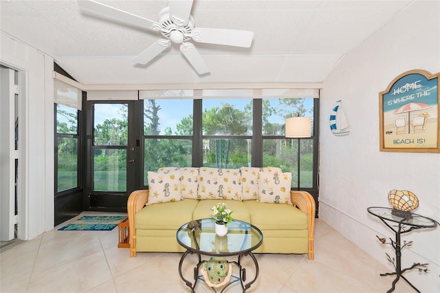 6796 Gasparilla Pines Blvd Unit 18, Englewood, FL 34224 - living area with tile patterned floors, ceiling fan, and lofted ceiling