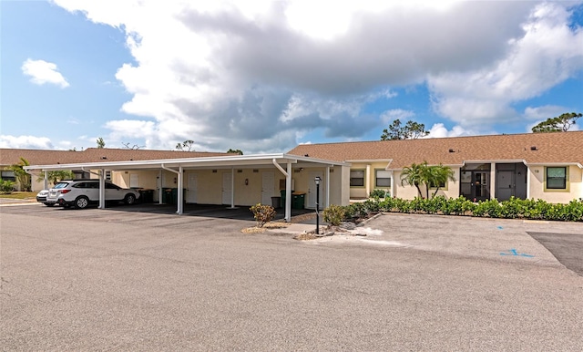 6796 Gasparilla Pines Blvd Unit 18, Englewood, FL 34224 - view of front facade with covered parking and stucco siding