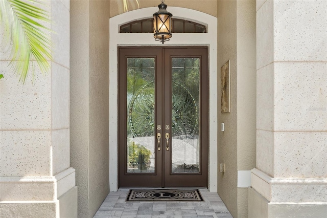 5850 Saddle Oak Trl, Sarasota, FL 34241 - doorway to property featuring french doors and stucco siding