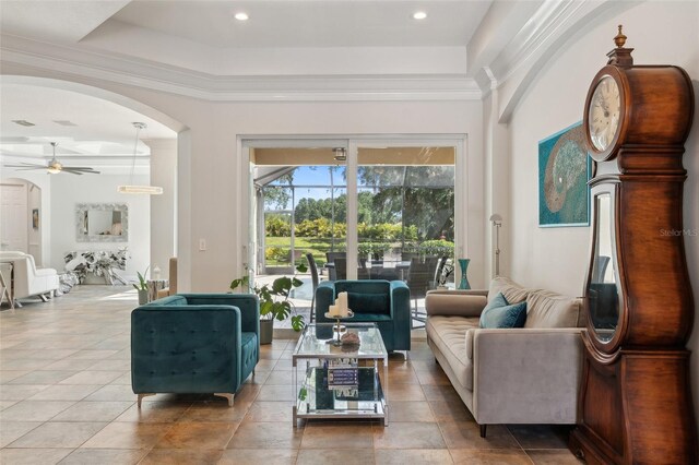 5850 Saddle Oak Trl, Sarasota, FL 34241 - living area featuring arched walkways, a ceiling fan, and crown molding