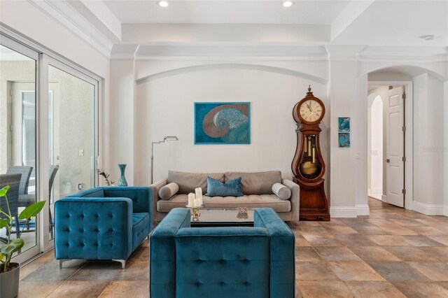 5850 Saddle Oak Trl, Sarasota, FL 34241 - living room featuring arched walkways, stone finish floors, baseboards, and recessed lighting