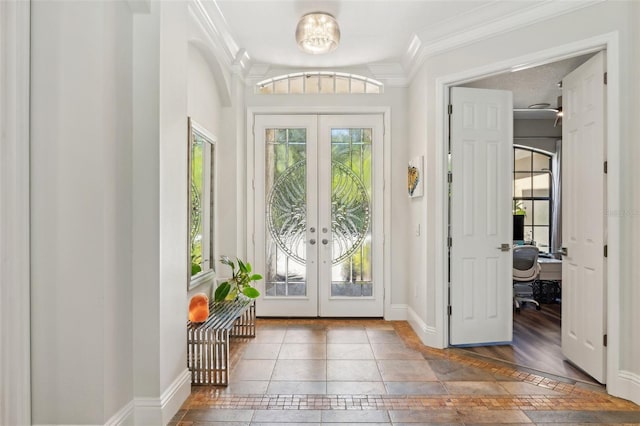 5850 Saddle Oak Trl, Sarasota, FL 34241 - entryway featuring french doors, inlaid floor details, baseboards, and ornamental molding