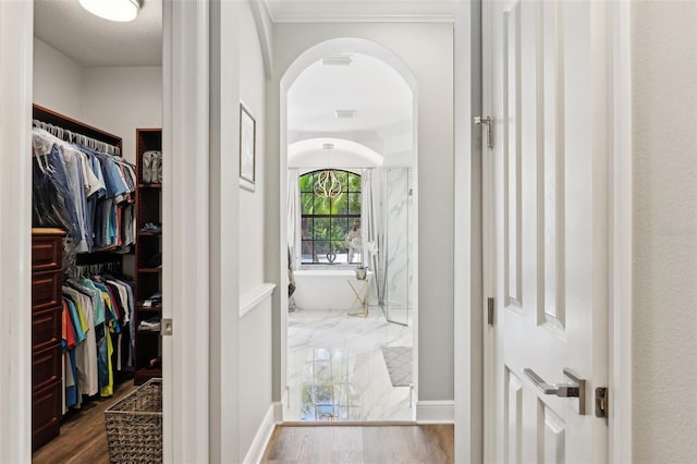 5850 Saddle Oak Trl, Sarasota, FL 34241 - spacious closet featuring arched walkways and dark wood-style floors