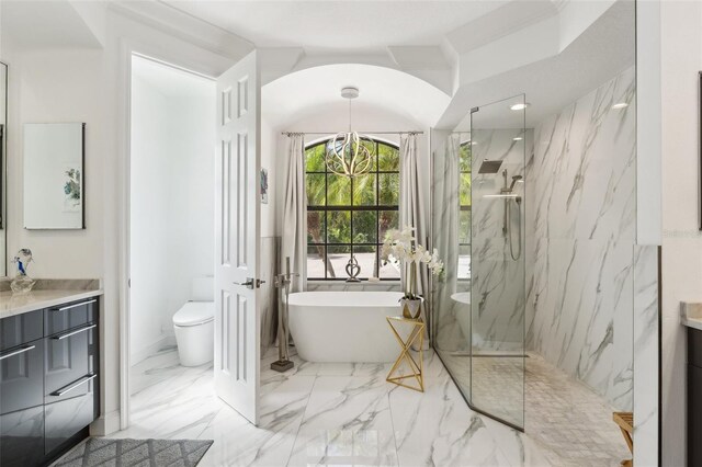 5850 Saddle Oak Trl, Sarasota, FL 34241 - bathroom with vanity, a marble finish shower, a freestanding bath, toilet, and marble tiled floors