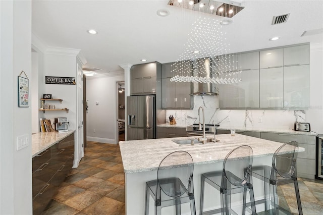 5850 Saddle Oak Trl, Sarasota, FL 34241 - kitchen featuring stainless steel refrigerator with ice dispenser, gray cabinets, crown molding, modern cabinets, and baseboards