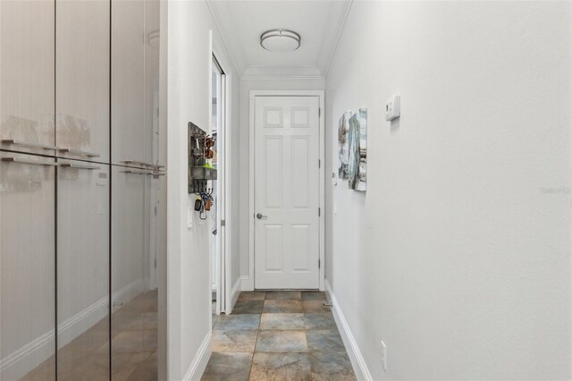 5850 Saddle Oak Trl, Sarasota, FL 34241 - hallway with crown molding, baseboards, and stone finish floors