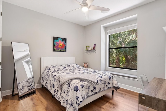 5850 Saddle Oak Trl, Sarasota, FL 34241 - bedroom with wood finished floors, baseboards, and ceiling fan